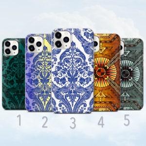May include: Five different phone cases with various patterns. The cases are all white with different designs. The designs include a blue and white damask pattern, a yellow and blue damask pattern, a green damask pattern, a colorful geometric pattern, and a gray and blue geometric pattern.