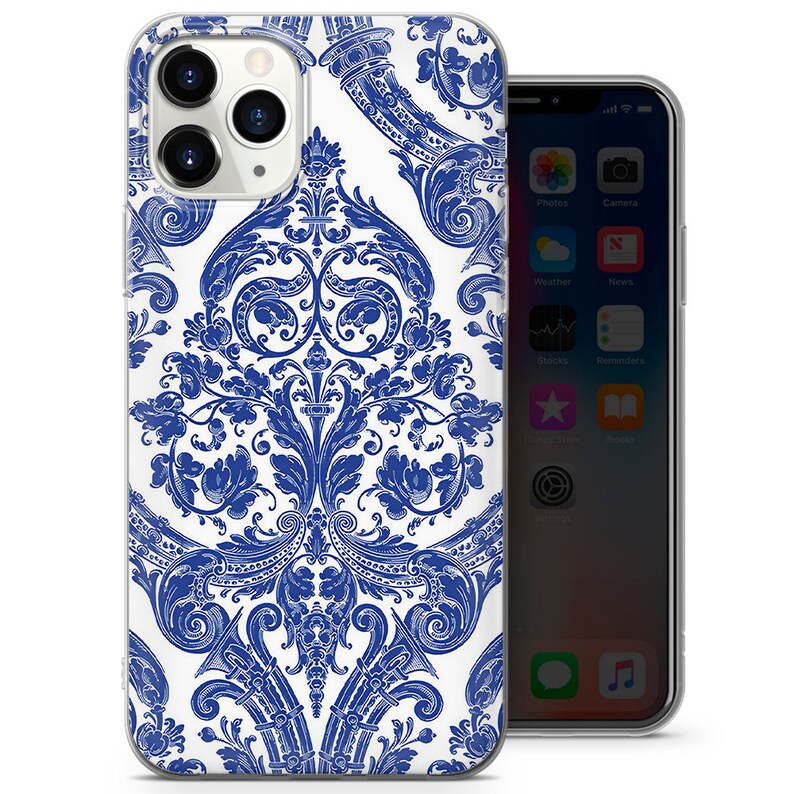 May include: A clear phone case with a white background and a blue damask pattern. The case is designed for an iPhone.