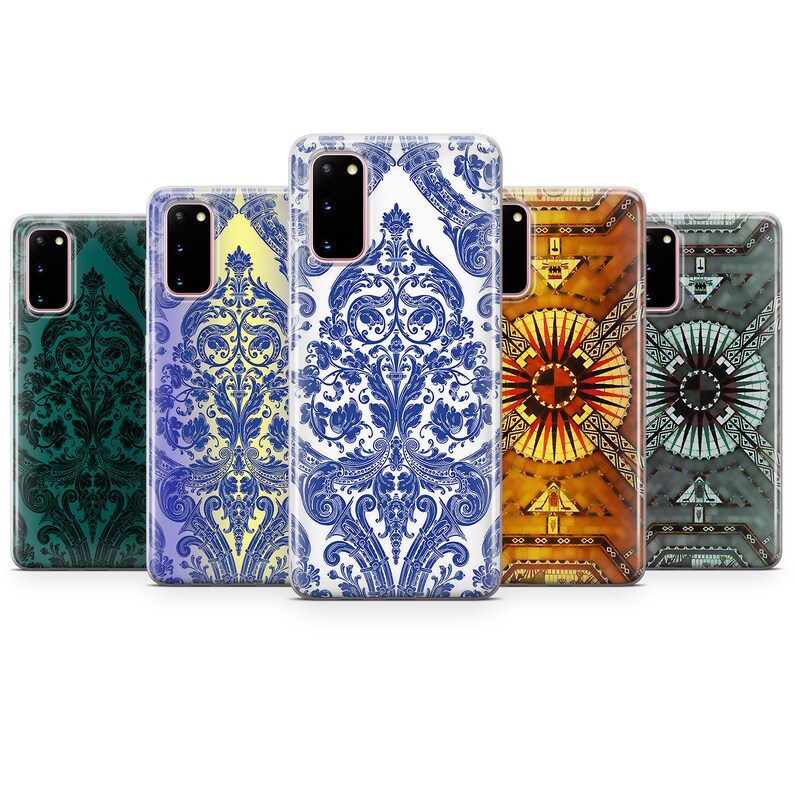 May include: Five different phone cases with various designs. The cases are clear and show the design through the case. The designs include a blue and white damask pattern, a green damask pattern, a yellow and white damask pattern, a colorful geometric pattern, and a blue and gray geometric pattern.