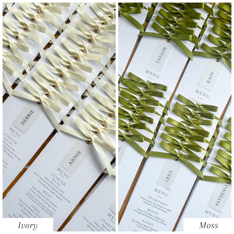 May include: Ivory and moss green wedding menu cards. The ivory cards have cream-colored bows with gold accents. The moss green cards have green bows. Each card has a guest's name and the word "MENU" printed on it.