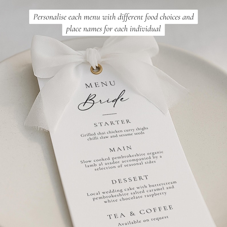 May include: A white wedding menu card with a white ribbon and gold eyelet. The menu reads "Bride" and lists a starter, main course, dessert, and tea & coffee. The text "Personalise each menu with different food choices and place names for each individual" is at the top.