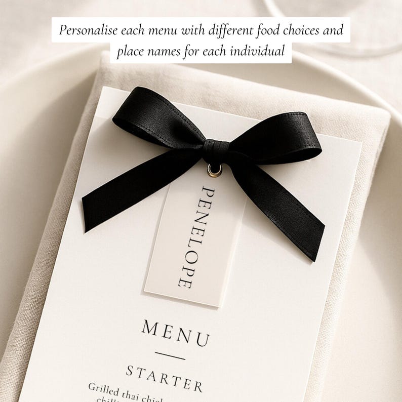 May include: A white menu card with the name "PENELOPE" on a tag, tied with a black ribbon bow. The menu reads "MENU" and "STARTER" with text below. The image includes the text "Personalise each menu with different food choices and place names for each individual."