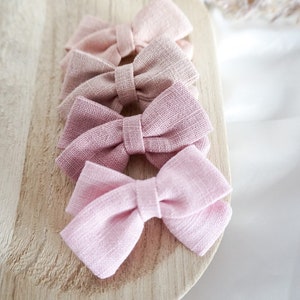 Süße Kinder Haarschleifen in Rosa für Mädchen mit Haarspangen oder als mitwachsendes Haarband für Babys. Das Must have für jedes Mädche. Bild 1