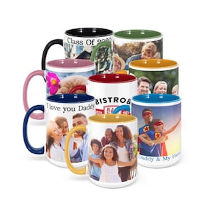 May include: Set of 10 ceramic coffee mugs with different colored rims and personalized photo designs. The mugs feature various images, including a graduation cap, a family portrait, a superhero, and a bistro logo.
