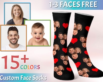 May include: A pair of black socks with red hearts and multiple faces printed on them. The socks are shown on a white background with the text "1-3 FACES FREE" and "15+ COLORS Custom Face Socks".