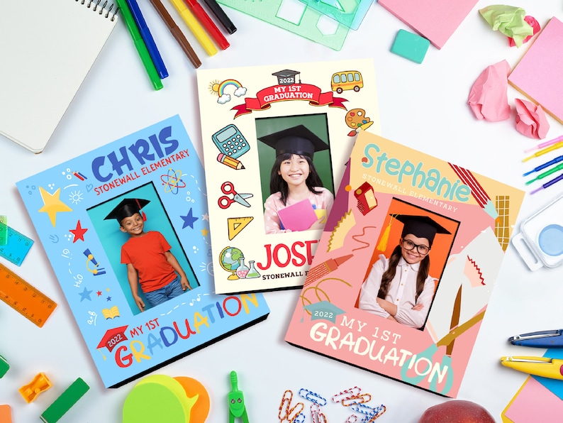 May include: Three graduation photo frames with colourful borders and illustrations. The frames are decorated with school supplies, stars, and the text "My 1st Graduation". Each frame features a child wearing a graduation cap and gown.