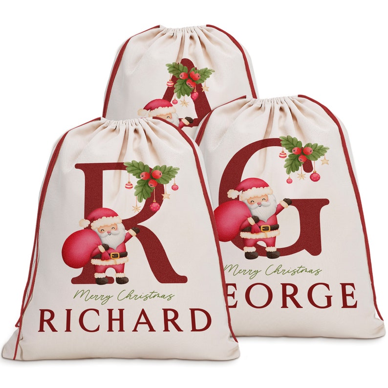 May include: Three personalized Christmas gift bags with red and white Santa Claus designs. The bags are made of natural canvas fabric and feature the letters R, G, and A with the names Richard, George, and the text "Merry Christmas".