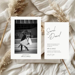 May include: Wedding invitation set featuring a black and white photo of a couple kissing, with the text "Save the Date" and the date 08.17.2027. The second card has the names "Sarah and Daniel" and wedding details.