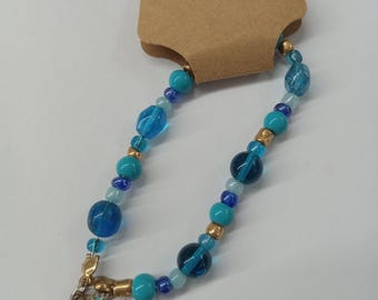 Blue moon. Blue beaded bracelet with moon charm.