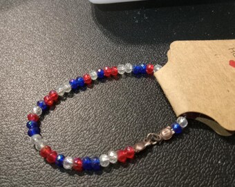 A lightweight red, white and blue dainty bracelet.