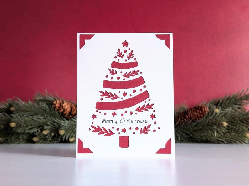 A pretty Christmas tree made from cuts of sprigs, circles, and star-shaped flowers.