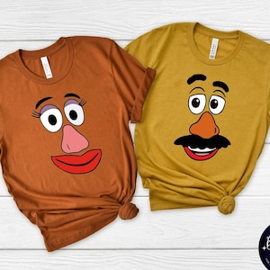 May include: Two brown and yellow t-shirts with a Mr. and Mrs. Potato Head design. The shirts are a fun and festive way to show your love for the classic movie.