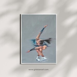 May include: An artistic print of a figure skater in motion, rendered in muted blues and grays. The skater is captured mid-performance, with arms extended and legs crossed. The artwork is framed in white, with the website address www.gnielsenart.com at the bottom.