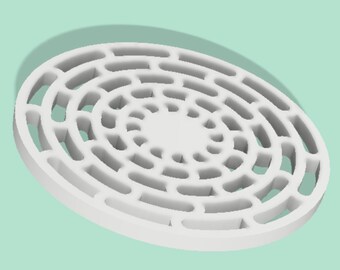 May include: A white, circular object with a series of concentric rings and rectangular cutouts. The object is made of a solid material and has a smooth surface. The design is symmetrical and geometric, with a central solid circle.