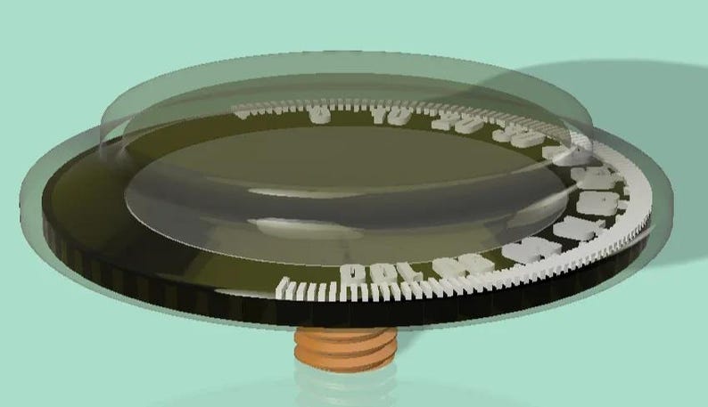 May include: A 3D-rendered image of a circular gauge with a transparent cover. The gauge has a black base, a dark green center, and a white scale with numbers. A brown, threaded base supports the gauge.