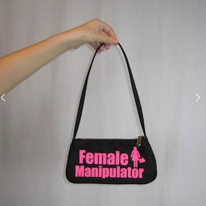 Female Manipulator Purse
