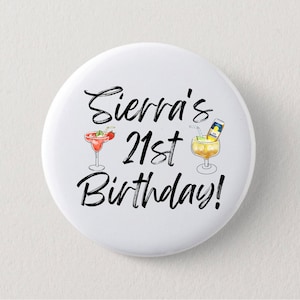 May include: White button with the text "Sierra's 21st Birthday!" in black script. The button features illustrations of two cocktails, one a margarita and the other a beer cocktail.