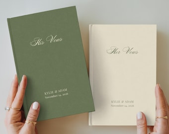 May include: Two hardcover vow books with a matte finish. The left book is sage green with the text His Vows, Kylie & Adam, and November 14, 2026. The right book is cream with the text Her Vows, Kylie & Adam, and November 14, 2026.