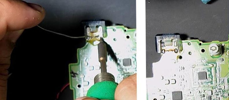 May include: Close-up of a circuit board with a soldering iron in use. The board is green with various components and a small connector. A thin wire is being soldered to the connector. The image shows the process of electronics repair or modification.