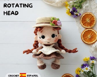 Könnte beinhalten: Eine Häkelpuppe mit rotbraunen geflochtenen Haaren, einem beigen Hut mit kleinen Blumen, einem braunen Kleid und einer weißen Schürze. Die Puppe hat einen um 360 Grad drehbaren Kopf. Der Text lautet 360 degree rotating head und crochet pattern.