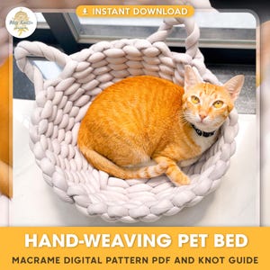 May include: A white macrame pet bed with two handles, woven in a basket shape. A ginger cat is lying in the bed. The image text reads "HAND-WEAVING PET BED" and "MACRAME DIGITAL PATTERN PDF AND KNOT GUIDE".