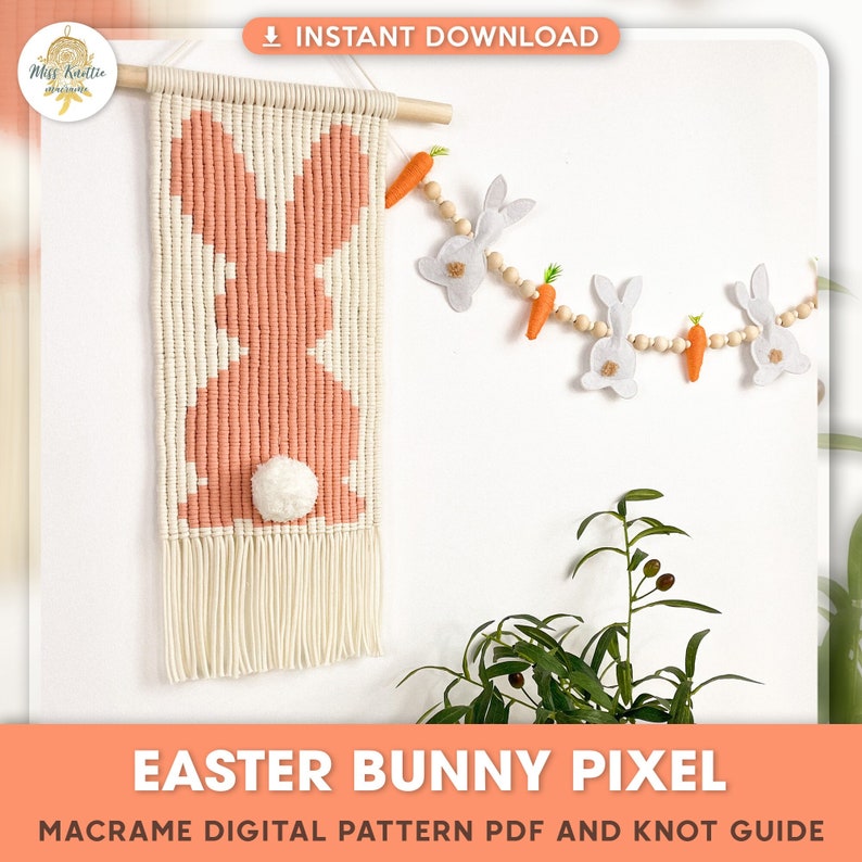 May include: A digital pattern for a macrame Easter bunny wall hanging. The pattern includes a knot guide and is available for instant download. The image shows a finished bunny wall hanging with a white background and a pink bunny with a white pom-pom tail.