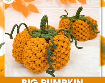 May include: Two handmade macrame pumpkins in shades of orange, with green stems and vines. The pumpkins are displayed on a white surface, with orange leaves in the background. The text "BIG PUMPKIN" is visible.