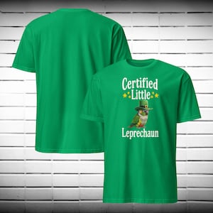 May include: A set of three ceramic mugs with a speckled, matte finish. Each mug features a different color: light blue, cream, and gray. The mugs have a simple, modern design with a rounded shape and a comfortable handle.