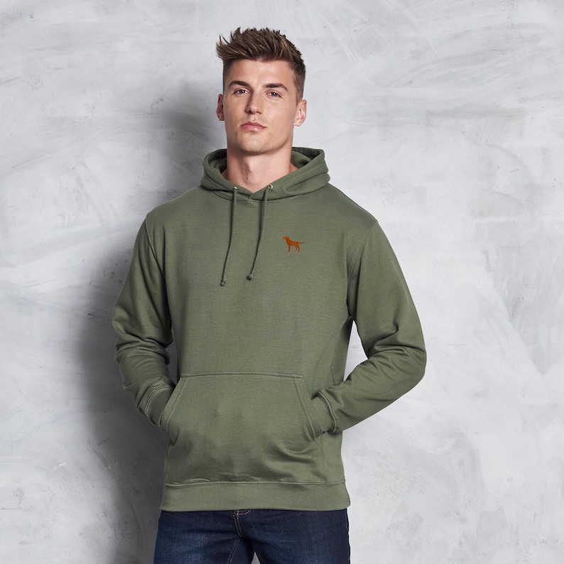 May include: A green hooded sweatshirt with a small orange dog silhouette embroidered on the chest.