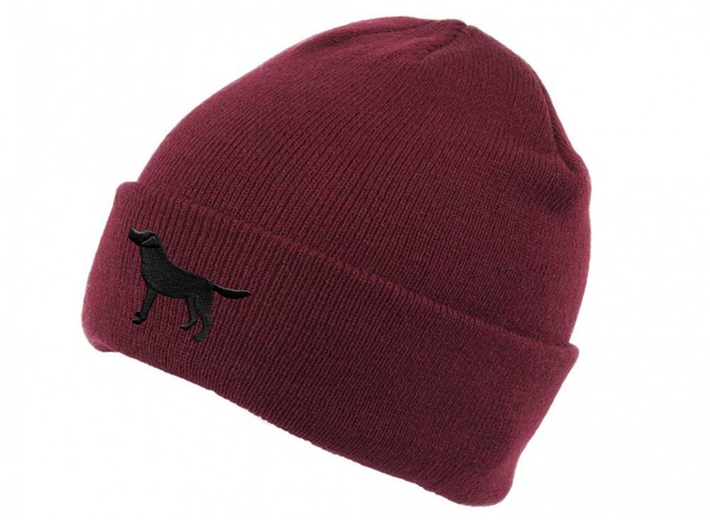 May include: A burgundy beanie with a black embroidered silhouette of a dog on the side.