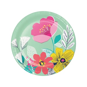 May include: A round, mint green paper plate decorated with colorful floral designs. The flowers include pink, red, and yellow blooms with green leaves and accents. The plate has a simple, clean design.