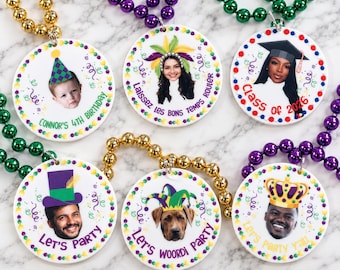 May include: Six round white ornaments with colorful beaded necklaces in gold, purple, and green. Each ornament features a custom photo of a person or dog wearing digital party hats or crowns, with printed text including Connor's 4th Birthday, Laissez les bons temps rouler, Class of 2026, Let's Party, and Let's Party Y'all.