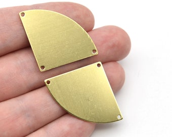 May include: Two brass-colored metal components, each with a semi-circular shape and three small holes. The metal has a brushed texture. The components are shown against a white background.