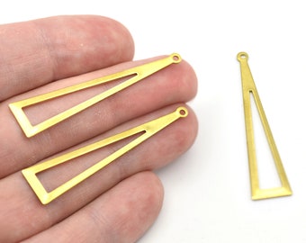 May include: Three gold-colored, open-frame triangle charms with a small hole at the top for stringing. The charms have a geometric design and are likely used for jewelry making or crafting. The background is white.