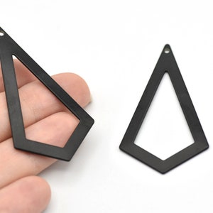 May include: Two matte black geometric earring components. Each component has a triangular shape with an open centre and a small hole at the top for attachment. The earrings are displayed on a white background.