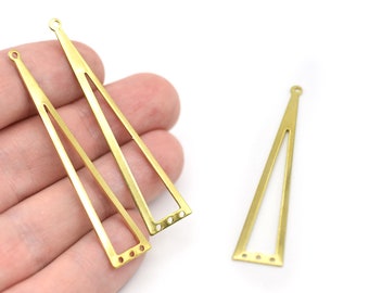 May include: Three gold-colored, elongated triangle-shaped jewelry components with a cutout design. Each piece has a small hole at the top for hanging and three holes at the bottom. The pieces are displayed against a white background.