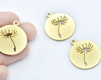 May include: Gold-colored round pendants with a dandelion design. Each pendant has a small loop at the top for attaching to a chain or other jewelry component. The dandelion is cut out of the metal, creating a delicate silhouette.
