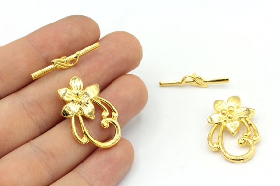 One price any size. Childs charm bracelet Gold plated flower toggle clasp 