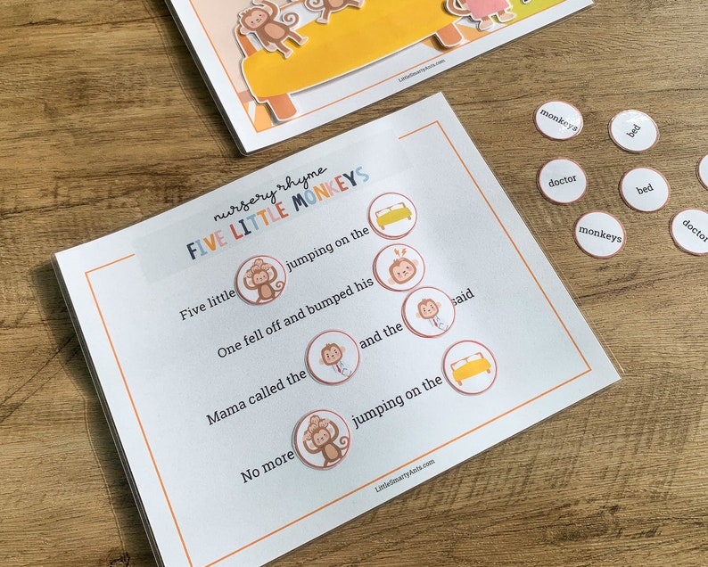 May include: A nursery rhyme activity sheet titled Five Little Monkeys with blank circular spaces for word placement. The sheet features printed text and illustrations of monkeys and beds. Several small circular tokens with words like monkeys, bed, and doctor are included.