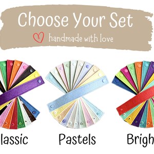 May include: Image features three sets of colorful felt bands, labeled "Classic," "Pastels," and "Brights." Each set displays a variety of hues, with snap closures. The text "Choose Your Set" and "handmade with love" is at the top.