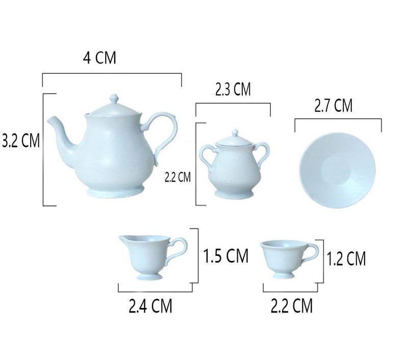 May include: A light blue tea set with a teapot, creamer, sugar bowl, cup, and saucer. The set is 4 cm tall, 2.7 cm wide, and 2.2 cm deep.