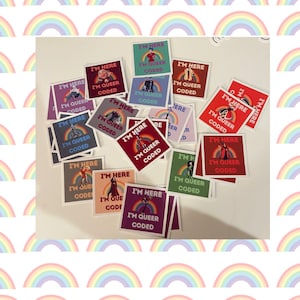 May include: A collection of colorful square stickers with the text "I'm here, I'm queer, coded" and a rainbow graphic. The stickers feature different illustrations of people.