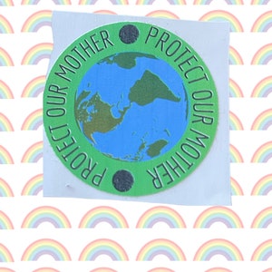 May include: Green and blue sticker with the text "Protect Our Mother" repeated twice in a circle around a globe image.