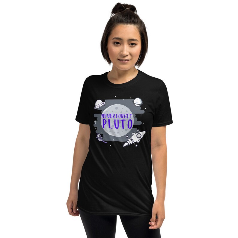 May include: A black t-shirt with a graphic of a moon, planets, a rocket, and an astronaut. The text "NEVER FORGET PLUTO" is written in purple on the moon.