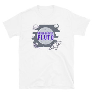 May include: White t-shirt with a gray moon and the text "NEVER FORGET PLUTO" in purple. The design also includes a rocket, an astronaut, a UFO, and a planet.