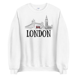 May include: White sweatshirt with a black and white illustration of the London skyline, including Big Ben, Tower Bridge, and a red double-decker bus. The text "LONDON" is printed in black below the illustration.