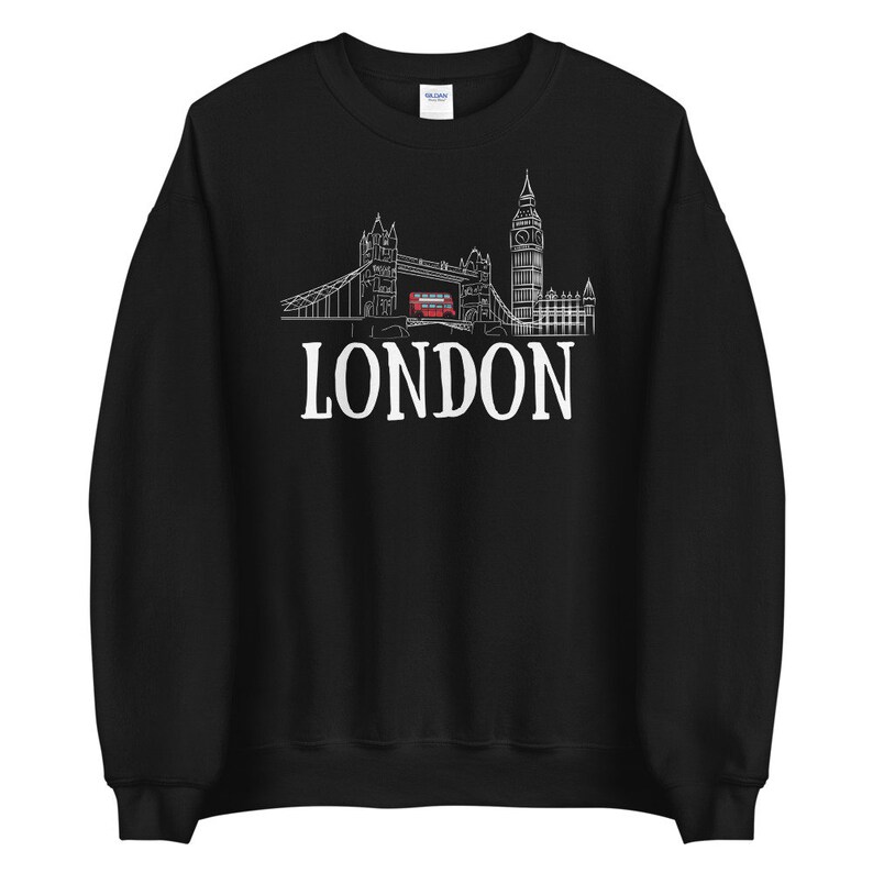 May include: Black sweatshirt with a white outline of the London skyline, including Big Ben, Tower Bridge, and a double-decker bus. The text "LONDON" is printed in white below the skyline.