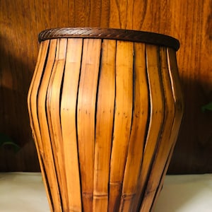 Bamboo vase. 11.5” high. 7.75” wide mouth. Rope carving on the wooden mouth of the vase.