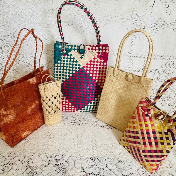 Handwoven palm leaves party favor, utility bags. Coconut coir bags.  Dried, hand dyed and woven. With handle.  Varied sizes 10”-5.5” tall.