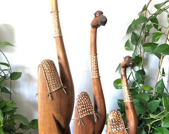 Camel Wooden figurine. Hand carved. Hand etched. Bordered with sea grass. Dot art painting.  Tallest is 40”. Comes in 3 sizes.